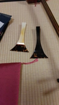 Two of my Sensei's more expensive 撥（ばち）or picks for Shamisen.  The white  one is made of elephant tusk and tortoiseshell. 